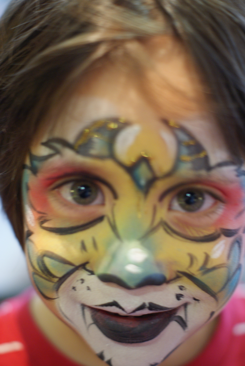 multicoloured cute little monster face painting by London Face Painters